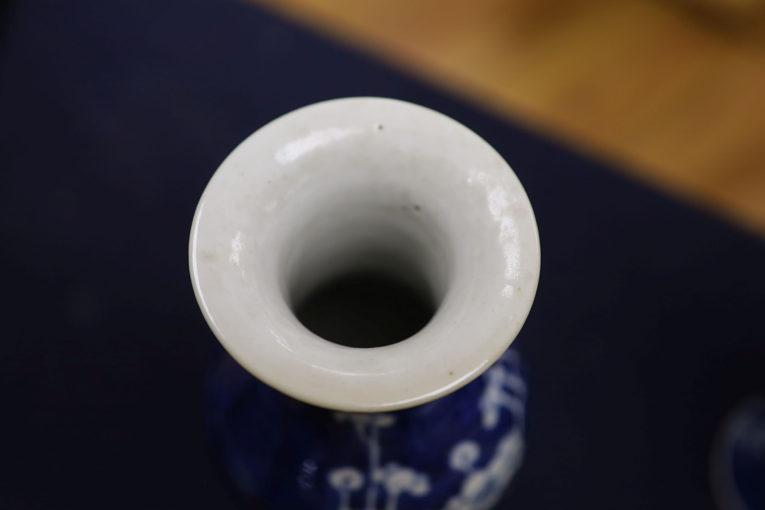 A pair of slender Chinese blue and white prunus vases, late 19th century, height 30cm